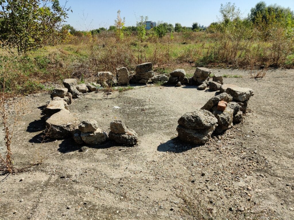 A circle of small concrete stones as if a mini Stonehenge