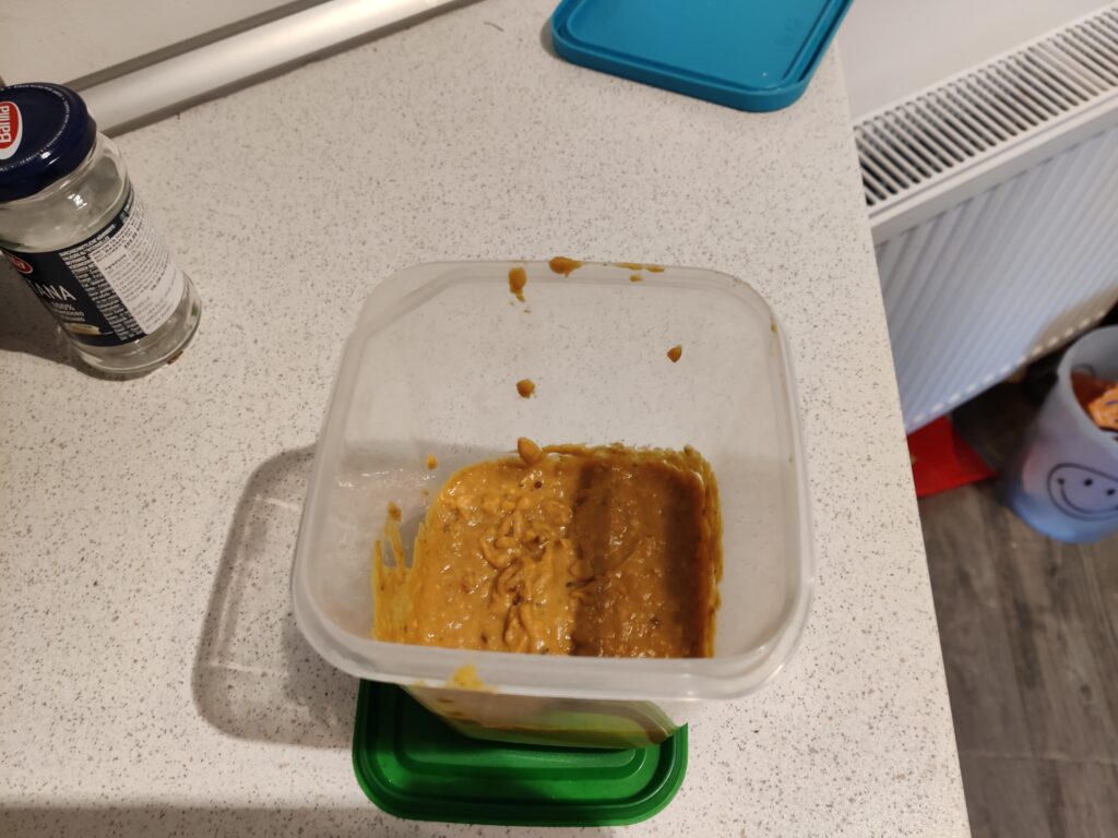 Bean pate in a plastic storage container.